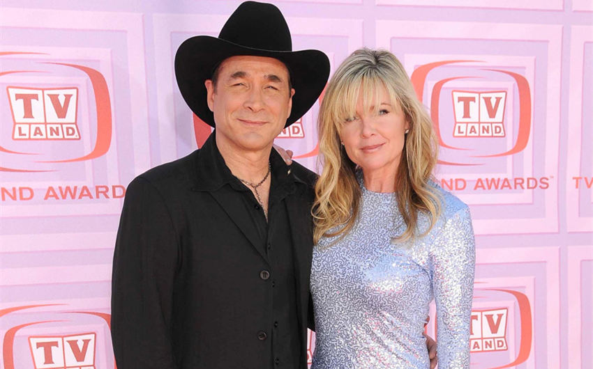 how old is clint black's wife